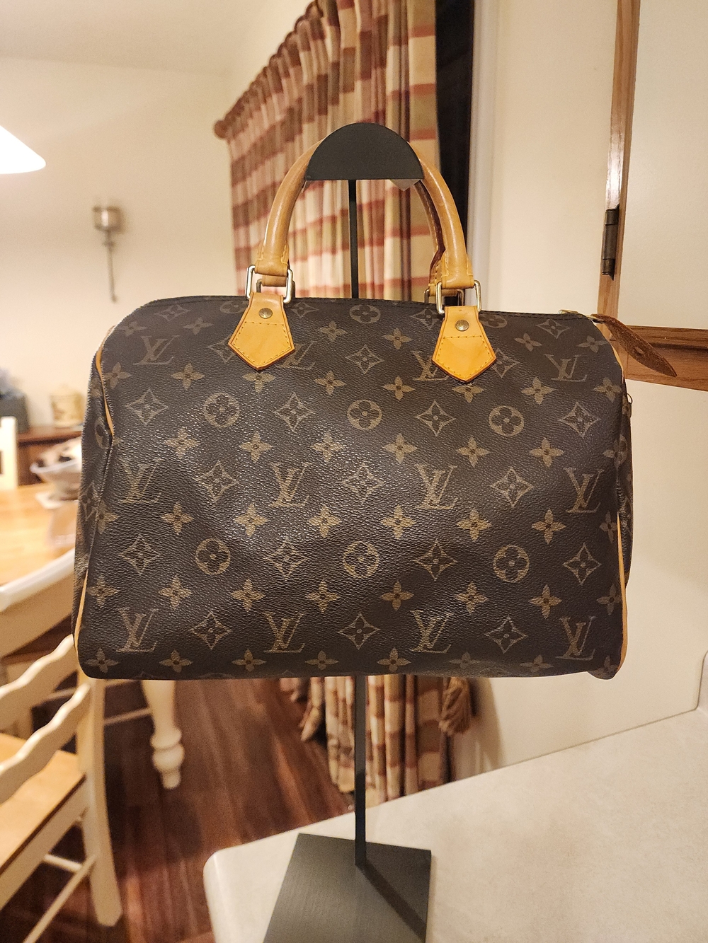 classic Louis Vuitton Monogram Speedy 30 featuring iconic brown coated monogram